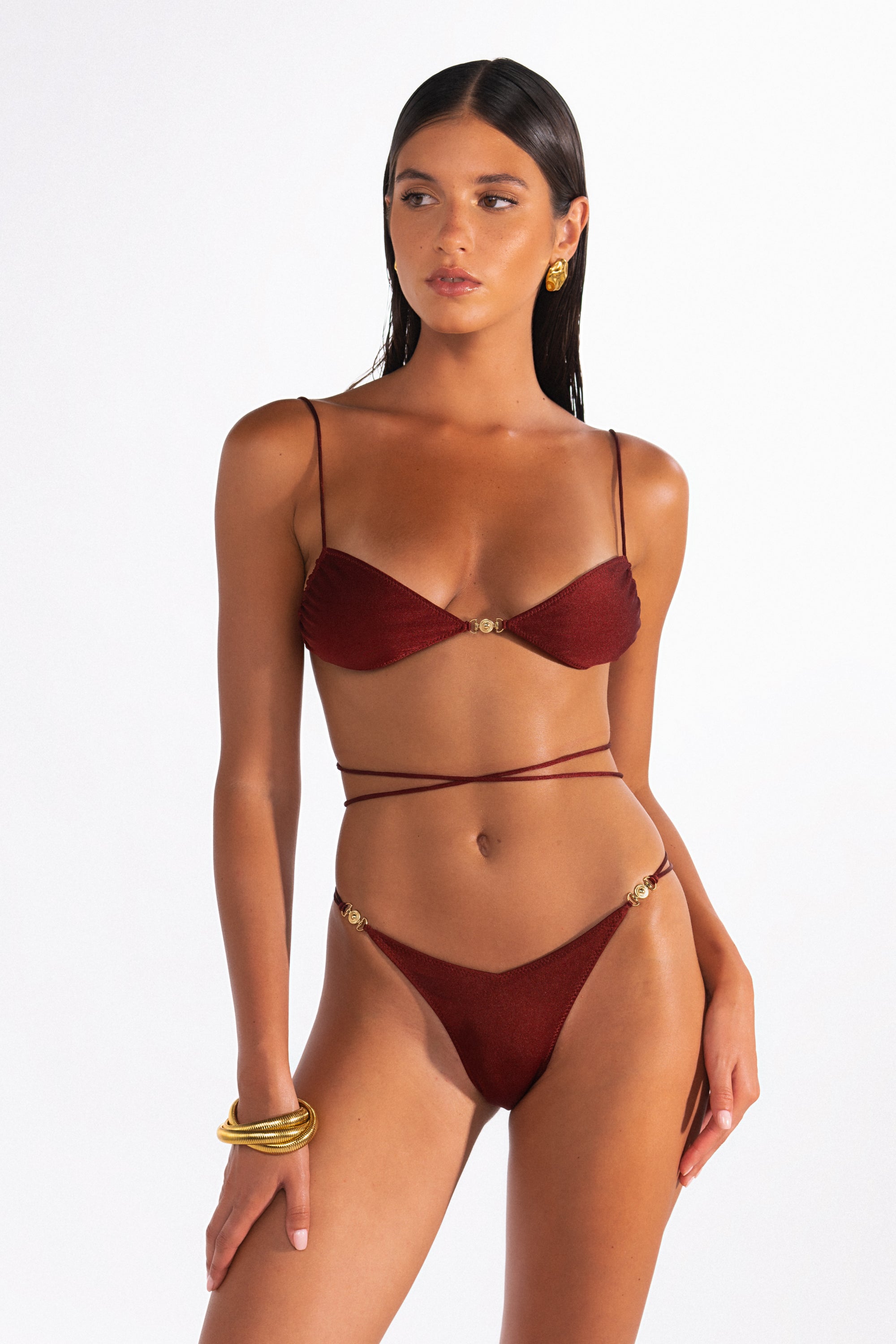 Lia Ribera Brazilian bikini bottom with V-cut front and gold hardware detailing.