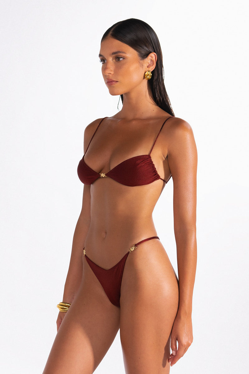 Model wearing the Lia Ribera Brazilian cut bikini bottom and matching bikini top.