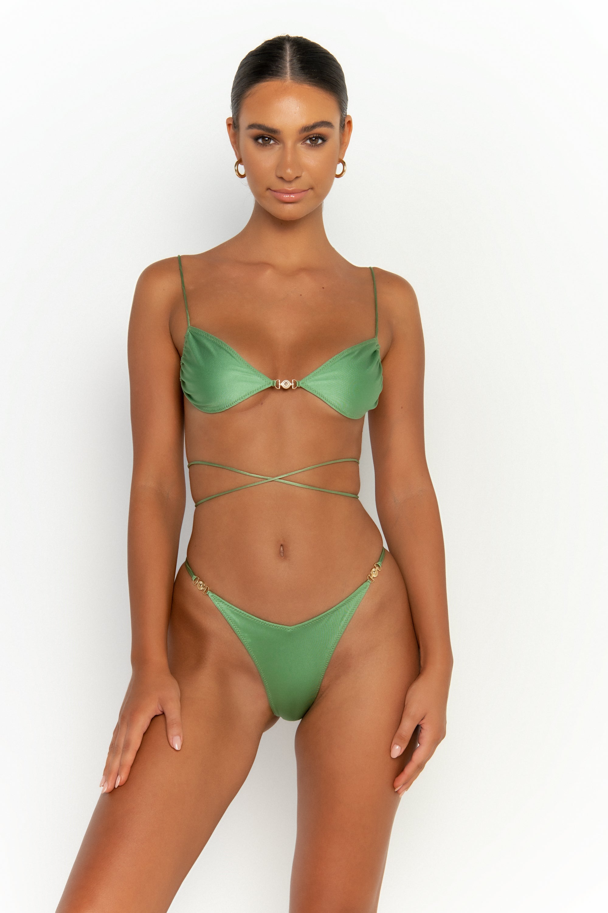 front view elegant woman wearing luxury swimsuit from sommer swim - lia maltese is a mint green bikini with brazilian bikini bottom